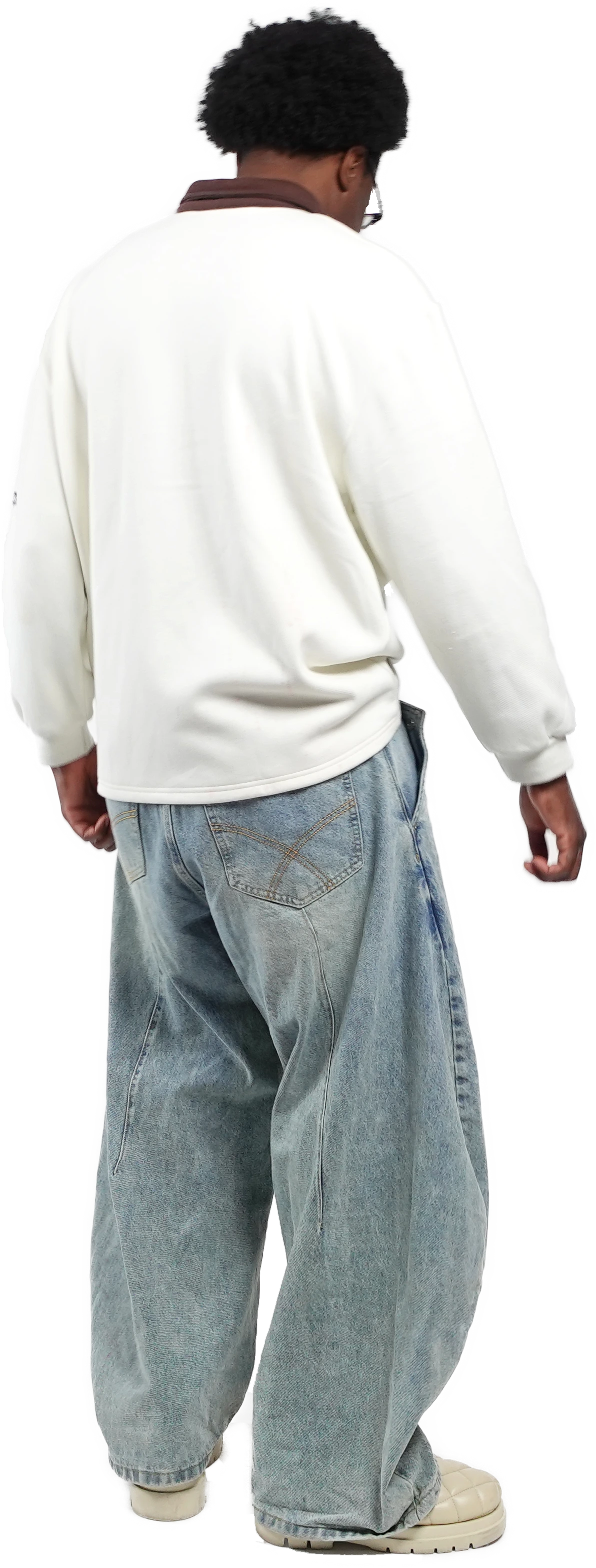 Male model wearing TROPE Labs Curve 1010 light blue barrel jeans with a white varsity sweatshirt