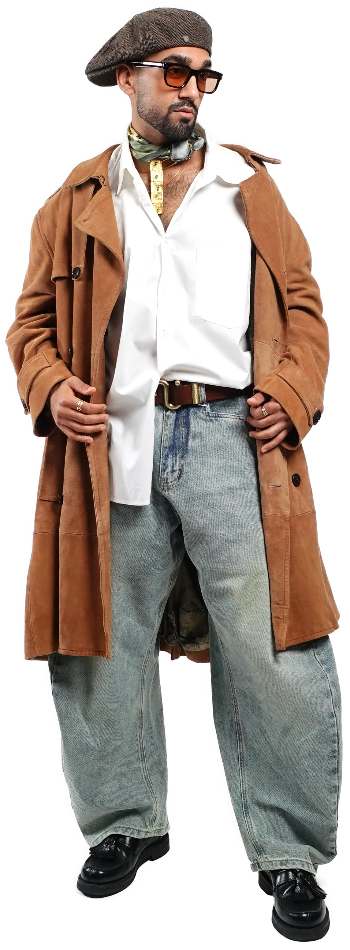 Model wearing a brown trench coat, beret, sunglasses, and light blue barrel jeans